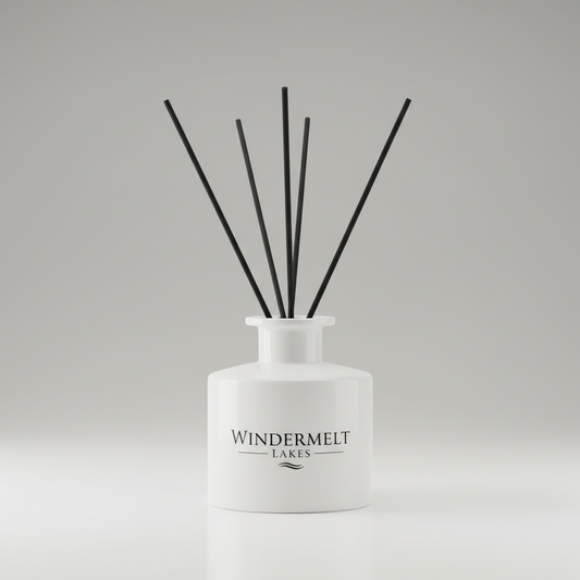 white reed diffuser vessel with black Windermelt Lakes logo, a